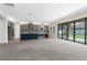 Spacious area with island kitchen, modern appliances, and sliding door access to backyard at 21878 Amelia Rose Way, Land O Lakes, FL 34637