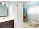 The bathroom features a single sink vanity with a shower/tub combination at 22396 Nyack Ave, Port Charlotte, FL 33952