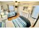 This bedroom has two beds, with a dresser, mirror, and mounted television for comfortable living at 22396 Nyack Ave, Port Charlotte, FL 33952