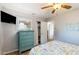 This beach themed bedroom features a television and blue dresser that offer style and comfort at 22396 Nyack Ave, Port Charlotte, FL 33952