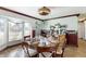 Charming dining room with a round table and bay window and butler's pantry at 22396 Nyack Ave, Port Charlotte, FL 33952
