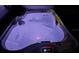 Modern hot tub with multicolor lighting, perfect for relaxing after a long day at 22396 Nyack Ave, Port Charlotte, FL 33952