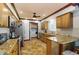 Bright kitchen with stainless steel appliances and granite countertops and adjacent laundry at 22396 Nyack Ave, Port Charlotte, FL 33952