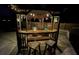 Outdoor pergola with bar, seating and firepit, perfect for entertaining guests at night at 22396 Nyack Ave, Port Charlotte, FL 33952