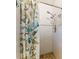 Shower with white subway tile and decorative shower curtain at 22396 Nyack Ave, Port Charlotte, FL 33952