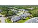 Wide aerial shot of the villas and mature landscaping in a desirable community, with easy access to nearby roads at 232 Hunter Ct, Palm Harbor, FL 34684