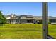 View of the backyard from the enclosed porch at 232 Hunter Ct, Palm Harbor, FL 34684