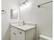 Bathroom with white vanity, quartz countertop, bronze fixtures, and a modern vanity light at 232 Hunter Ct, Palm Harbor, FL 34684