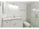 Bathroom with a white vanity featuring a quartz countertop and a shower with a glass enclosure at 232 Hunter Ct, Palm Harbor, FL 34684