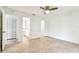 This bedroom features a ceiling fan and has easy access to the walk-in closet and bathroom at 232 Hunter Ct, Palm Harbor, FL 34684
