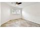 Bedroom with tile flooring, a window, and a ceiling fan at 232 Hunter Ct, Palm Harbor, FL 34684