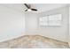 Bedroom featuring tile flooring, a window with blinds, and a ceiling fan at 232 Hunter Ct, Palm Harbor, FL 34684