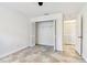 Bedroom featuring a closet with white louvered doors, tile flooring, and white walls at 232 Hunter Ct, Palm Harbor, FL 34684