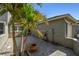 Beautiful paved driveway and walkway of this charming property, framed by a mature palm tree at 232 Hunter Ct, Palm Harbor, FL 34684