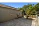 Backyard patio featuring beautiful pavers, potted plants, and a lush palm tree offering a relaxing outdoor space at 232 Hunter Ct, Palm Harbor, FL 34684