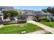 Charming home with lush lawn, manicured landscaping, and a convenient garage in a tranquil neighborhood at 232 Hunter Ct, Palm Harbor, FL 34684