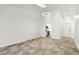 Bright living room features neutral tile flooring, modern light fixtures, and an open floor plan at 232 Hunter Ct, Palm Harbor, FL 34684