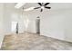 Bright living room features neutral tile flooring, high ceilings, and modern light fixtures at 232 Hunter Ct, Palm Harbor, FL 34684