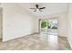 Bright living room features neutral tile flooring and sliding glass doors to the patio at 232 Hunter Ct, Palm Harbor, FL 34684