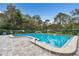 Beautiful pool surrounded by lush landscaping, offering a refreshing escape and a community space for relaxation at 232 Hunter Ct, Palm Harbor, FL 34684
