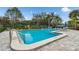 Community pool with surrounding lounge area for residents to enjoy at 232 Hunter Ct, Palm Harbor, FL 34684