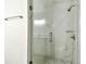 Bathroom features a shower with glass doors and updated hardware at 232 Hunter Ct, Palm Harbor, FL 34684
