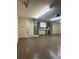 Garage featuring epoxy flooring, fluorescent lighting and utility connections at 2603 Valencia Grove Dr, Valrico, FL 33596