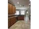 Kitchen featuring an island, stainless steel dishwasher, and tile backsplash at 2603 Valencia Grove Dr, Valrico, FL 33596