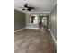 Open-concept living area featuring tile flooring and arched doorways leading to other rooms at 2603 Valencia Grove Dr, Valrico, FL 33596