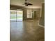 Bright living area features a sliding glass door to the pool area and a seamless transition to other rooms at 2603 Valencia Grove Dr, Valrico, FL 33596