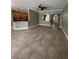 Open-concept living room showcases tile flooring and seamless flow to the kitchen, perfect for entertaining at 2603 Valencia Grove Dr, Valrico, FL 33596