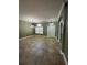 Spacious living room with large windows allowing natural light, neutral walls and tile flooring at 2603 Valencia Grove Dr, Valrico, FL 33596