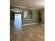 Spacious living room with an open layout leading to the outdoor patio, offering indoor-outdoor living at 2603 Valencia Grove Dr, Valrico, FL 33596