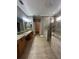 A spacious bathroom with granite counters, tile floors, and a walk-in shower at 2603 Valencia Grove Dr, Valrico, FL 33596