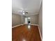 Hardwood floor main bedroom boasts ceiling fan and ensuite access, creating a private retreat at 2603 Valencia Grove Dr, Valrico, FL 33596