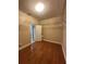 A large walk-in closet with wood floors and metal shelving at 2603 Valencia Grove Dr, Valrico, FL 33596