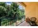 Relaxing outdoor balcony with lush greenery and a view of the community at 2674 Tanglewood Trl, Palm Harbor, FL 34685