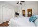 Bedroom showcasing closet, TV, and ensuite bathroom for convenience at 2674 Tanglewood Trl, Palm Harbor, FL 34685