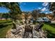 Outdoor firepit area with chairs, ideal for relaxing evenings in a pleasant community setting at 2674 Tanglewood Trl, Palm Harbor, FL 34685