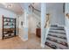 An elegant foyer with decorative columns, tiled floor, stairway and beautiful decor at 2674 Tanglewood Trl, Palm Harbor, FL 34685