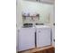 Convenient laundry room setup with washer and dryer at 2674 Tanglewood Trl, Palm Harbor, FL 34685