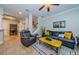 Bright living room with neutral paint, ceramic tile, and staircase access at 2674 Tanglewood Trl, Palm Harbor, FL 34685