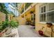 Paver patio with seating and garden view at 2674 Tanglewood Trl, Palm Harbor, FL 34685