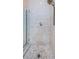 Modern shower featuring marble floors and tile walls at 2674 Tanglewood Trl, Palm Harbor, FL 34685