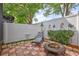 Serene backyard with a patio, seating, firepit, and privacy fence, perfect for relaxation at 2811 S Pines Dr # 15, Largo, FL 33771