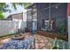 A brick-paved backyard patio with a firepit and outdoor seating extends the living space outdoors at 2811 S Pines Dr # 15, Largo, FL 33771