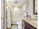 Bathroom featuring a tub and shower combination, vanity, and storage at 2811 S Pines Dr # 15, Largo, FL 33771