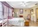 Cozy bedroom featuring hardwood floors, natural lighting, and ample space at 2811 S Pines Dr # 15, Largo, FL 33771