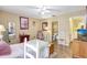 Bedroom with wood floors and bright light showcasing an open layout with many furnishings at 2811 S Pines Dr # 15, Largo, FL 33771
