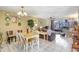 A brightly lit dining room opens into the living room and features sliding glass doors to the patio at 2811 S Pines Dr # 15, Largo, FL 33771